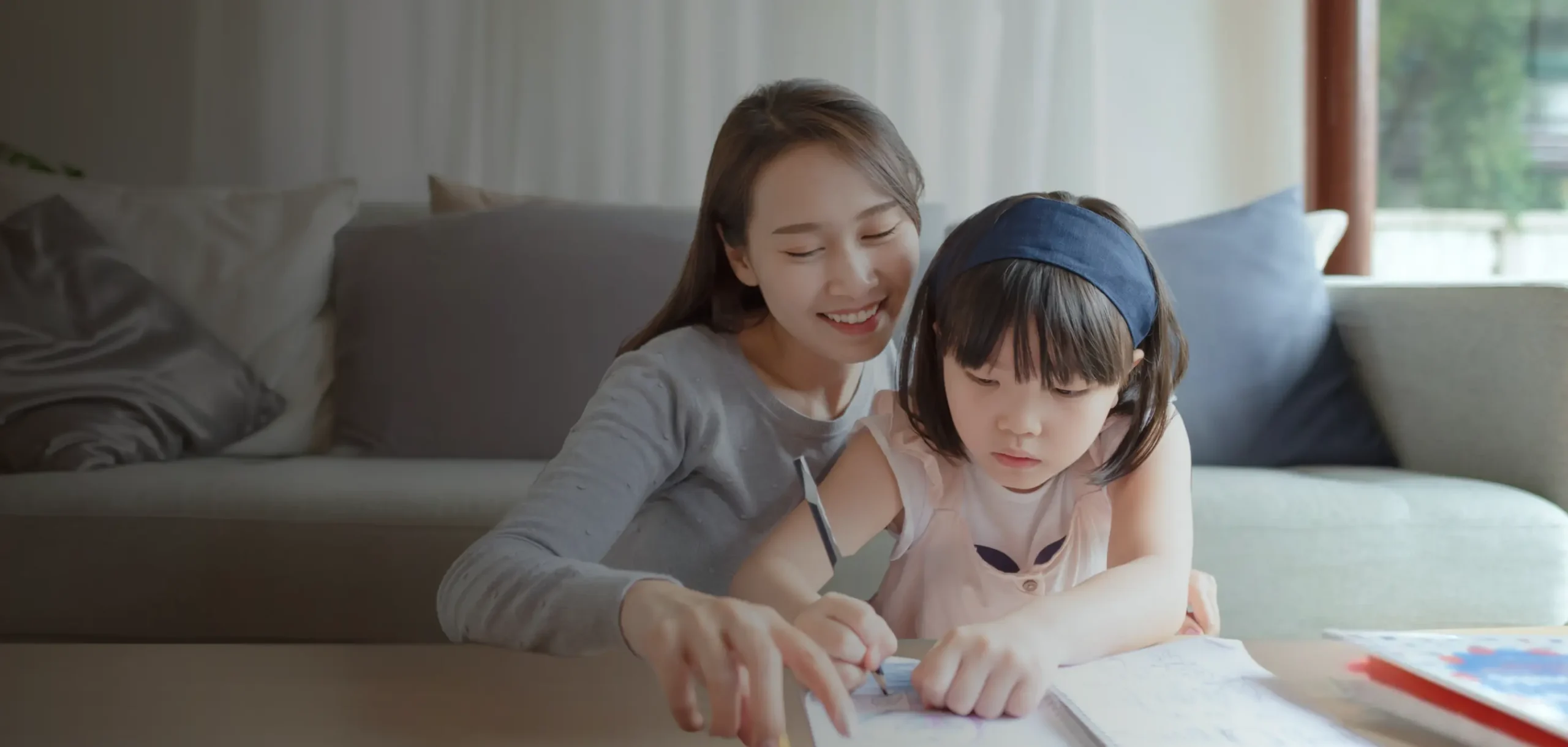 Mother supporting her daughter with learning